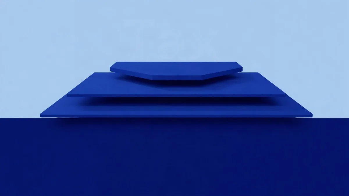 Abstract layered geometric shapes in blue and indigo tones on white background.